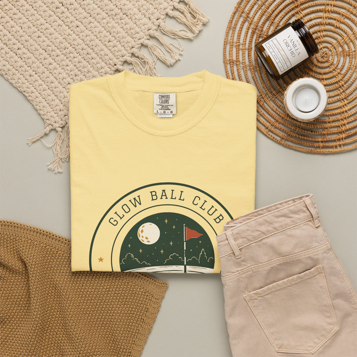 Glow Ball Club Tee in Butter, flat lay