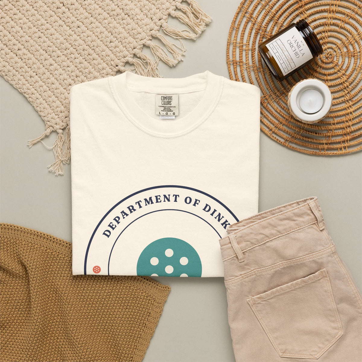 Department of Dinks Tee in Ivory, flat lay