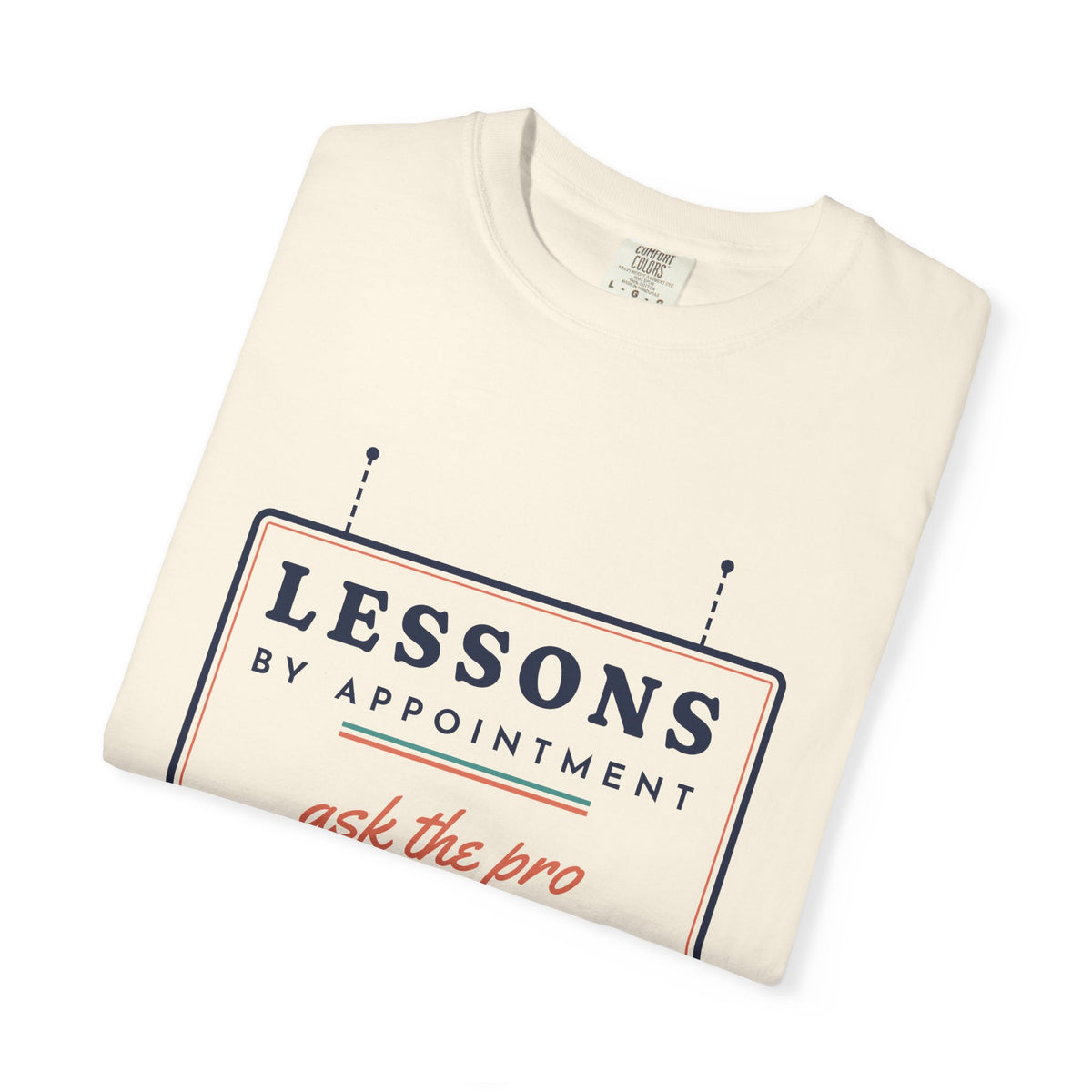 Lessons by Appointment Tee in Ivory, folded