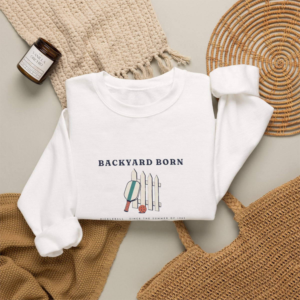 Backyard Born Crewneck in White, flat lay