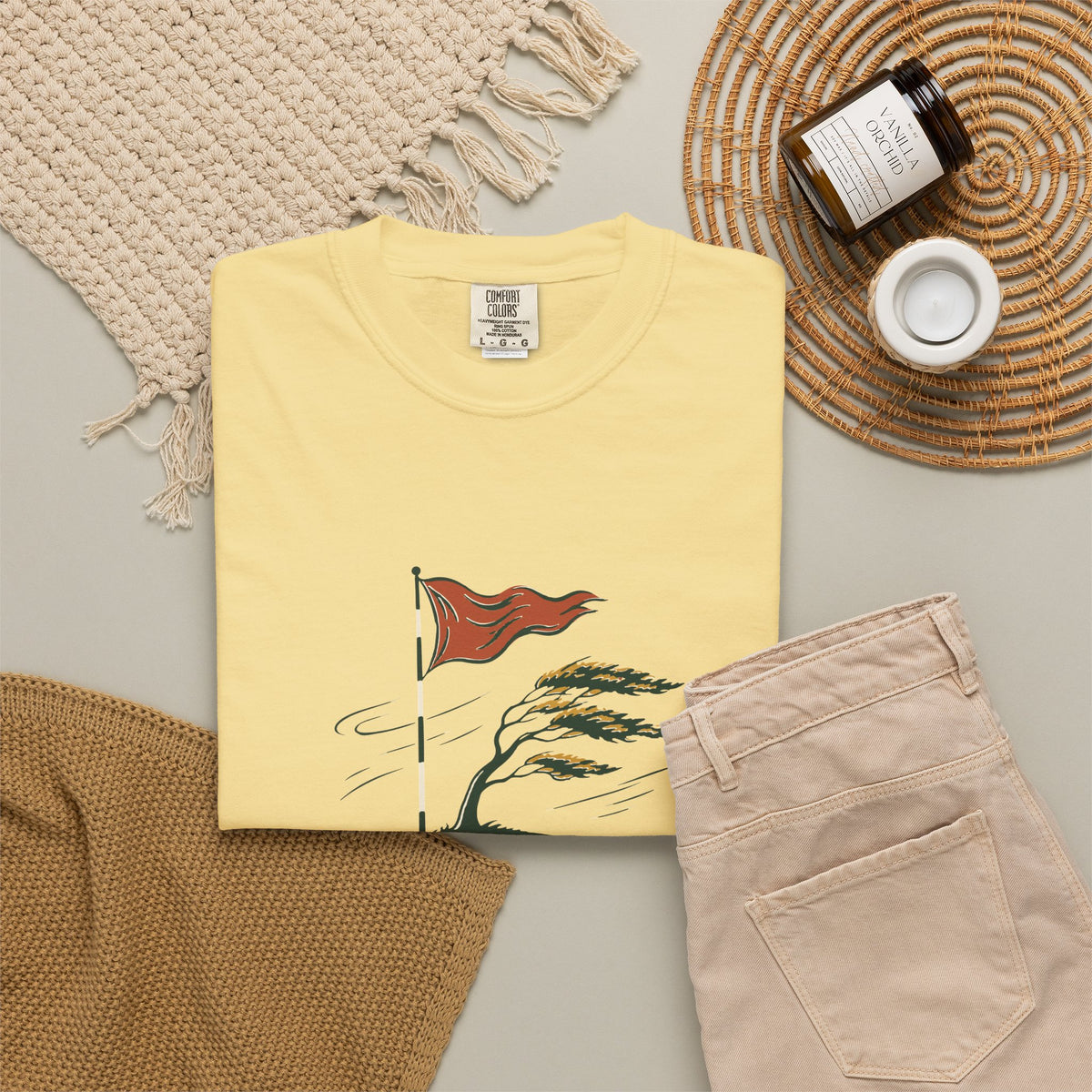 Into the Wind Tee in Butter, flat lay