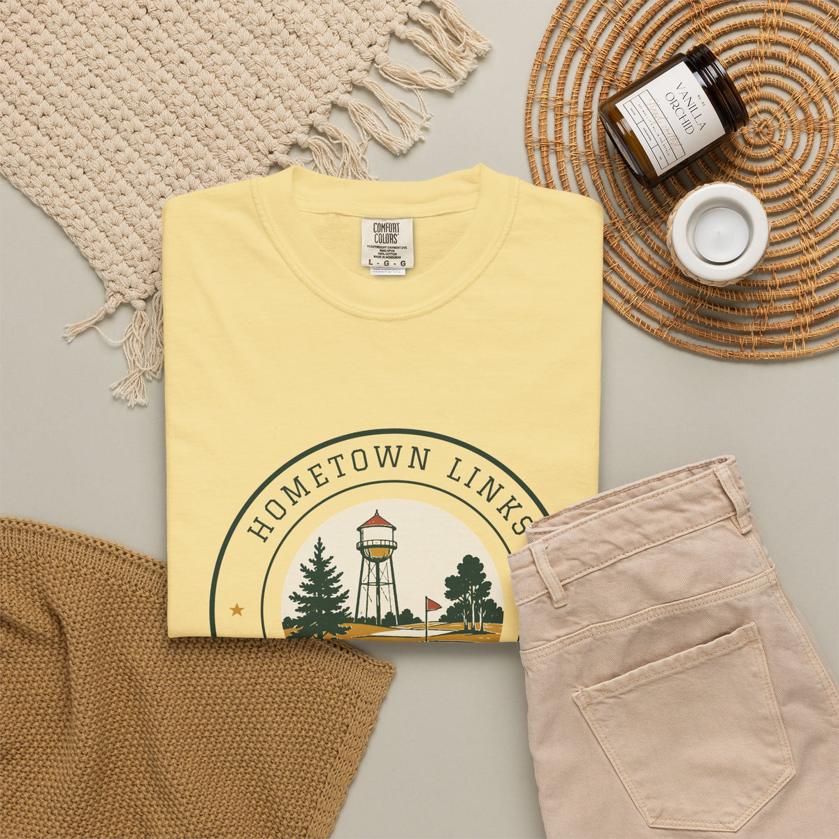 Hometown Links Tee in Butter, flat lay