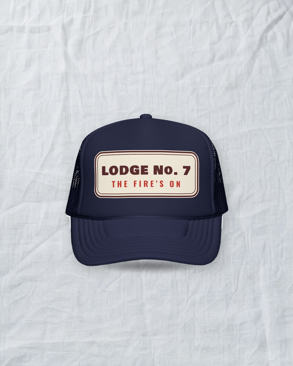 Lodge No. 7 Trucker Hat in Dark Navy, styled