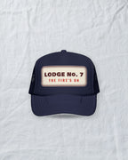 Lodge No. 7 Trucker Hat in Dark Navy, styled