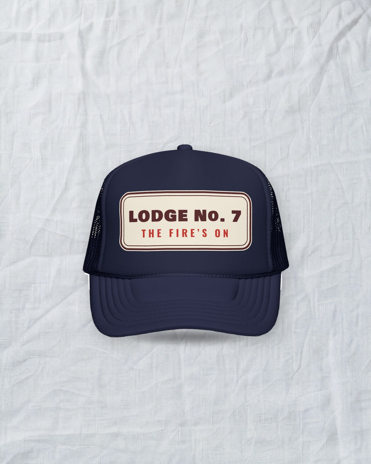 Lodge No. 7 Trucker Hat in Dark Navy, styled