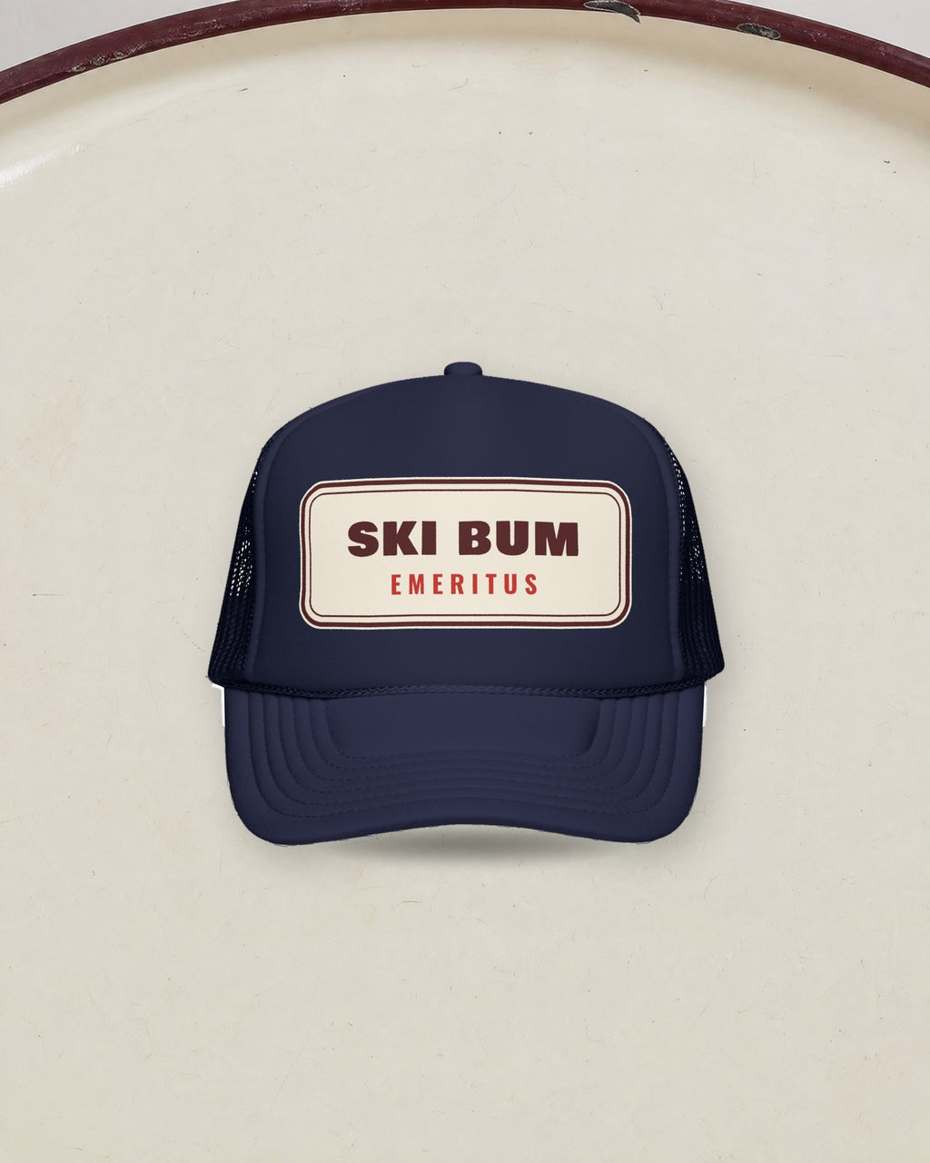 Ski Bum Emeritus Trucker Hat in Dark Navy, styled