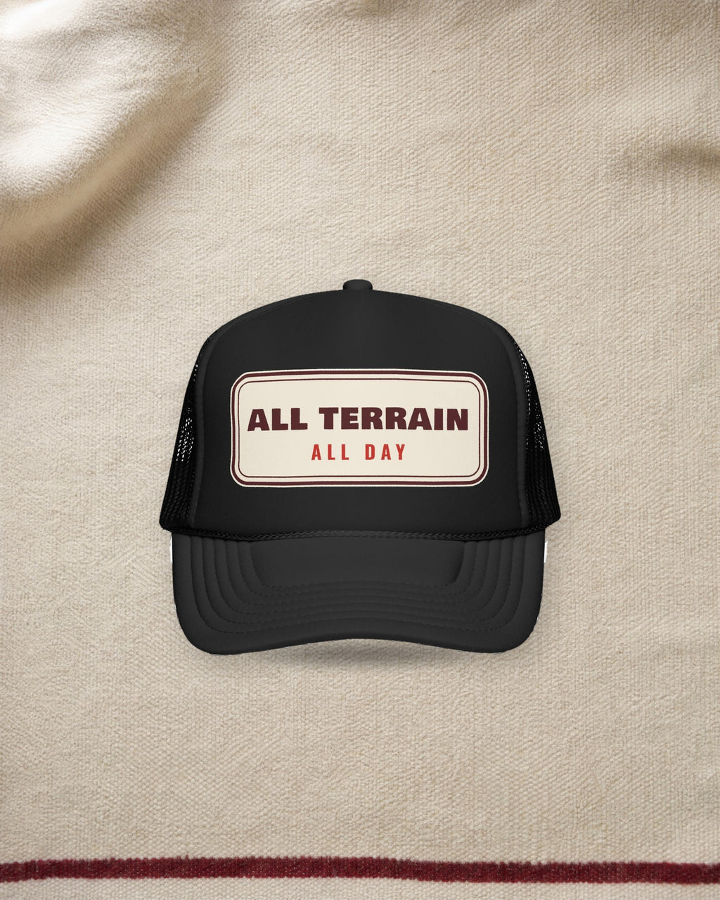 All Terrain Trucker Hat in Black, styled