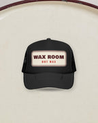 Wax Room Trucker Hat in Black, styled