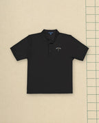 Public Links Arch Polo in Black, styled