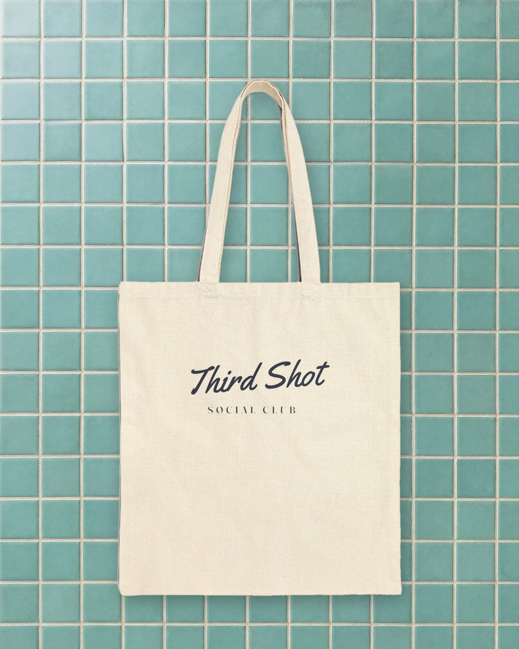 Script Chest Mark Tote in Natural, styled