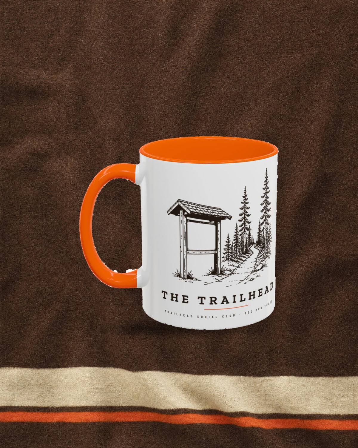 The Trailhead Mug in Orange, styled